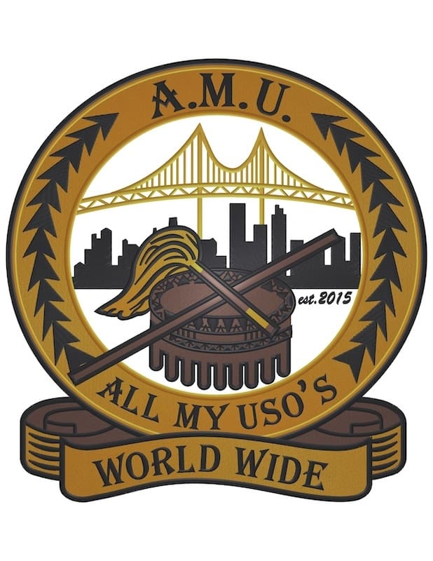 AMU emblem with bridge, skyline, drum